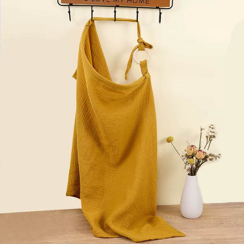 Breathable cotton muslin baby nursing cover by X With Love, offering privacy for breastfeeding and stroller use.