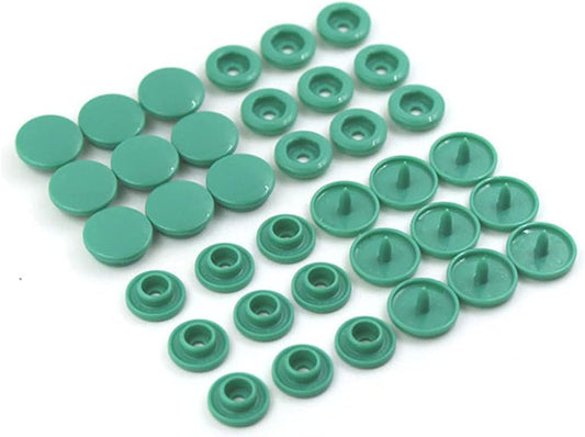 20 sets of X With Love T5 resin plastic snap buttons in grass green, showing pressed fasteners for clothing DIY projects.
