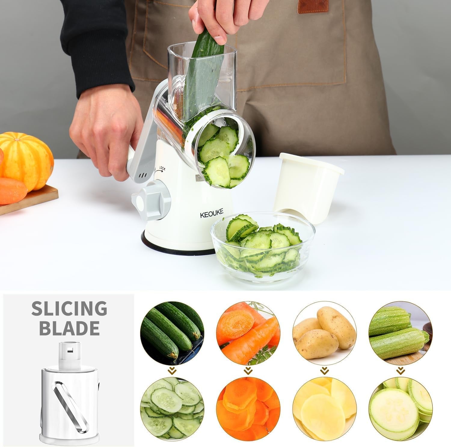 White rotary cheese grater with hand crank, three blades, non-slip suction base, for shredding cheese, vegetables, and nuts.