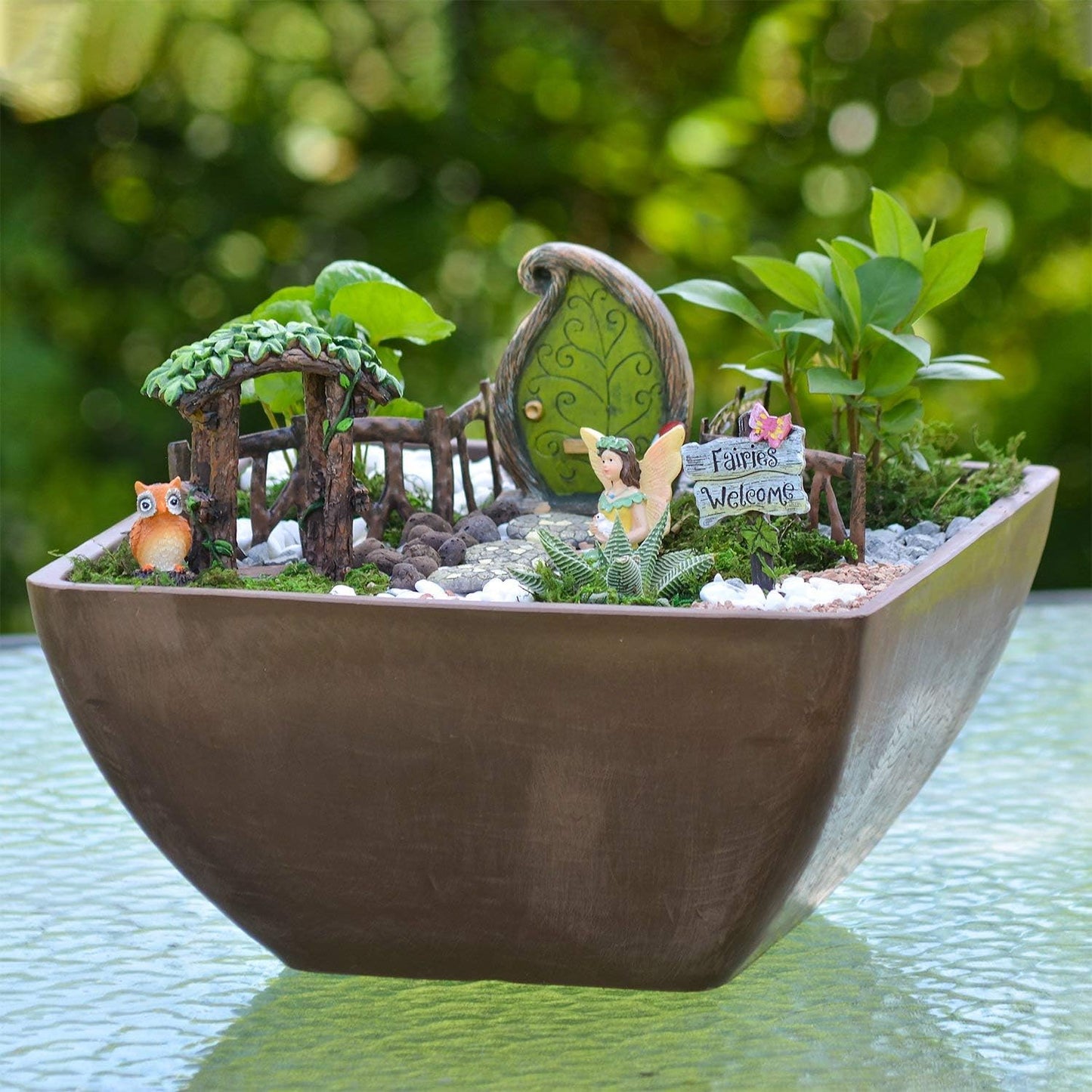 Charming Forest Fairy Garden Kit by X With Love featuring miniature fairy figurines, lush greenery, and whimsical outdoor decor.