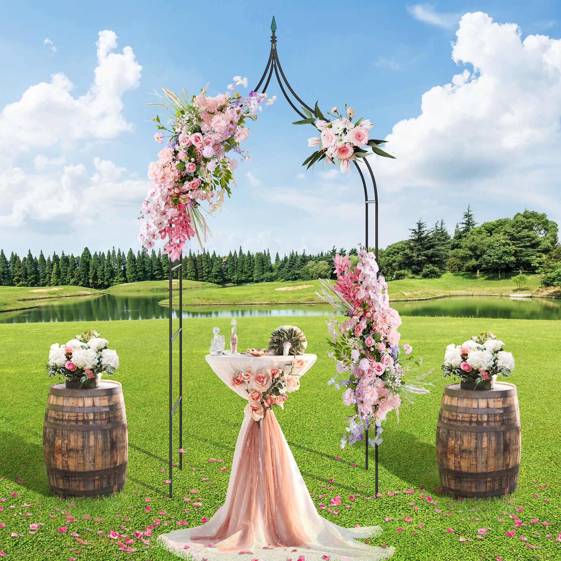 Steel garden arch rose arbor by X With Love with climbing plants and lush greenery in an outdoor garden setting