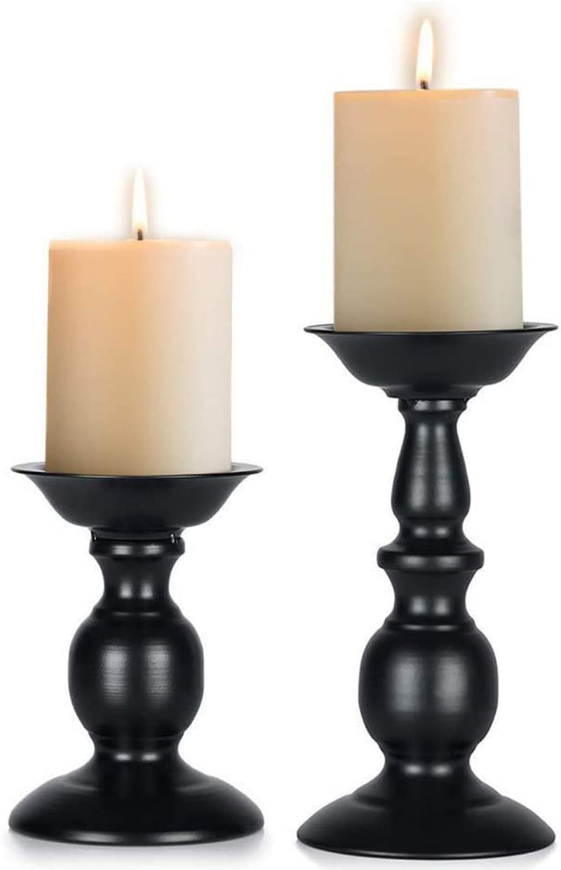 Set of two rustic black metal candle holders for pillar candles, tall retro design, ideal for farmhouse, Halloween, and Easter decor.