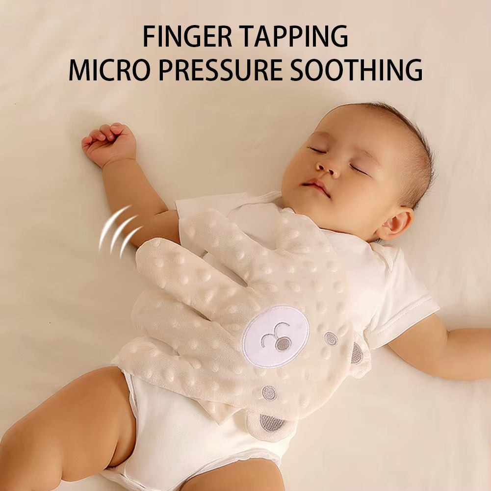 Soft baby sleep aid pillow with calming palm-shaped design, ideal for infants and toddlers to promote restful sleep.