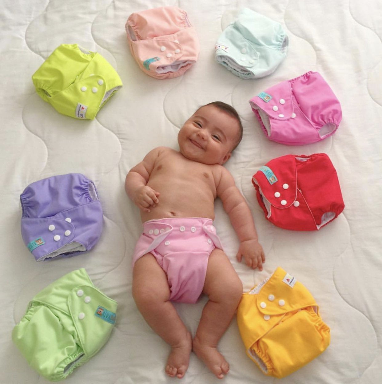X With Love newborn cloth diaper set for babies under 12 pounds, includes 6 pocket cloth diapers and 12 inserts.
