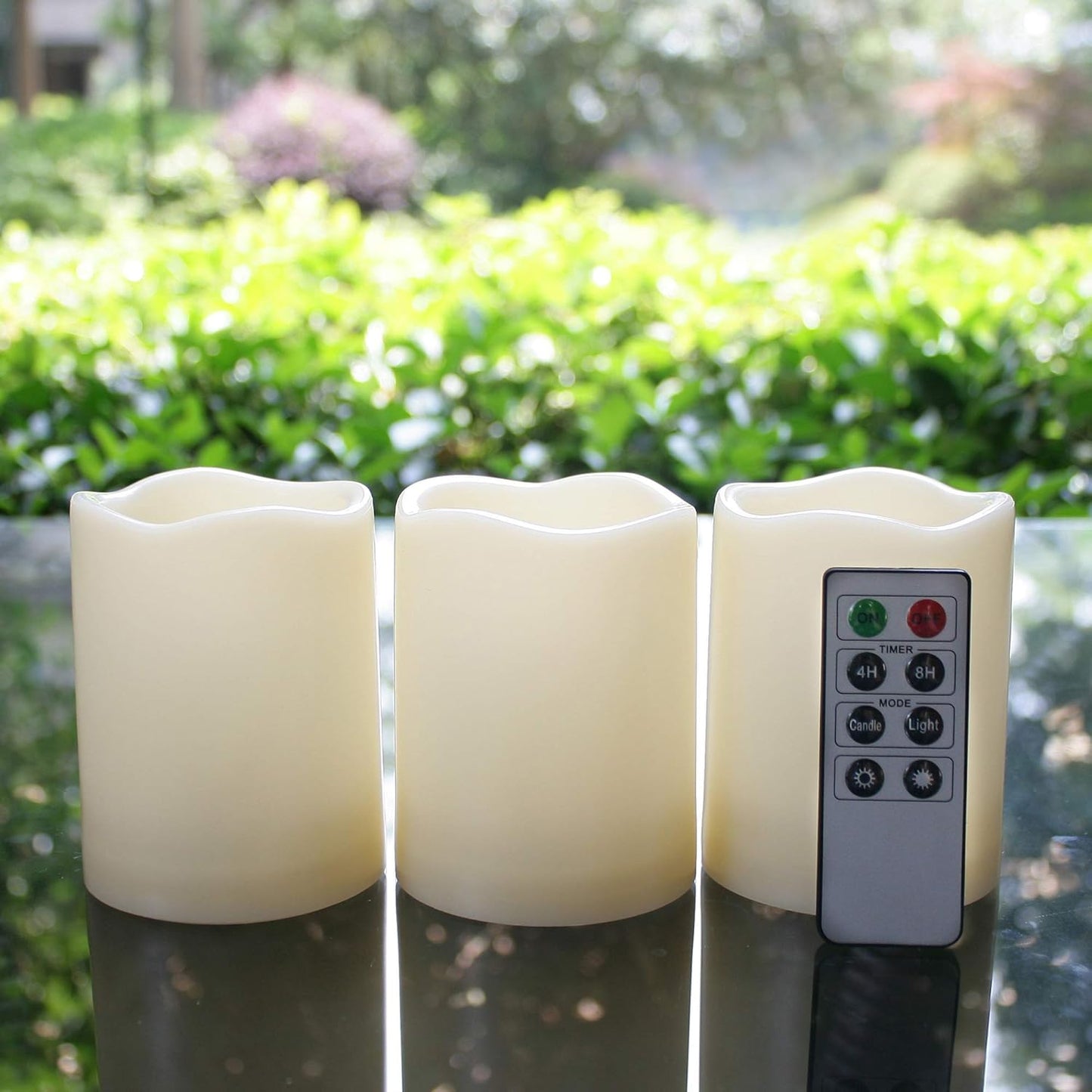 Set of three waterproof battery-operated flameless LED pillar candles with remote, flickering light, plastic resin for Christmas and wedding decor