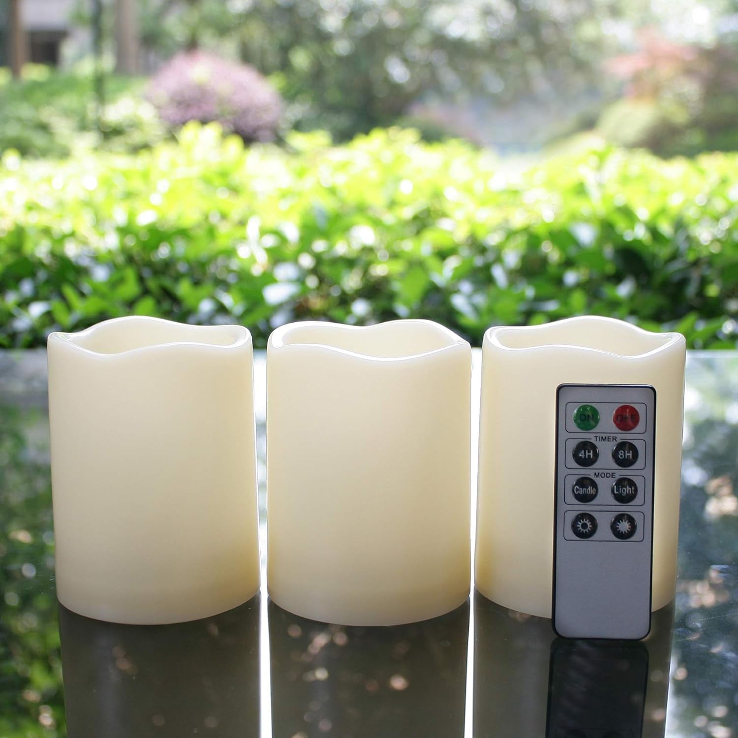 Set of three waterproof battery-operated flameless LED pillar candles with remote, flickering light, plastic resin for Christmas and wedding decor