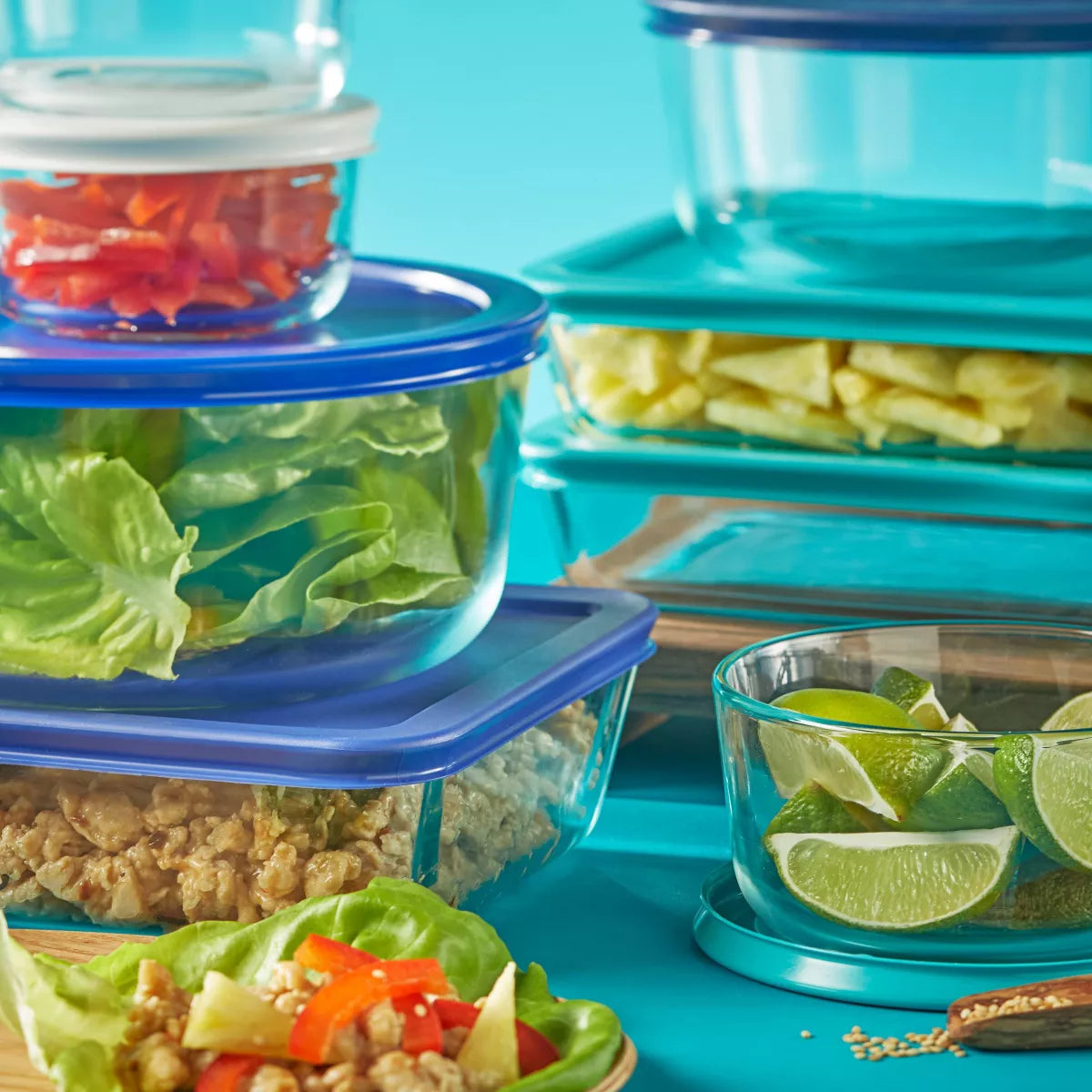 Set of Pyrex 18-piece glass storage containers from X With Love, featuring clear lids and various sizes for kitchen organization.