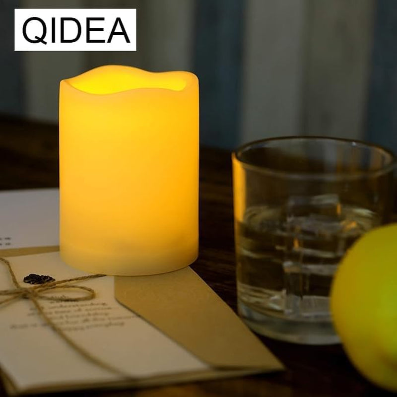 Set of three waterproof flameless LED pillar candles with remote, flickering glow, ideal for outdoor Christmas and wedding decorations