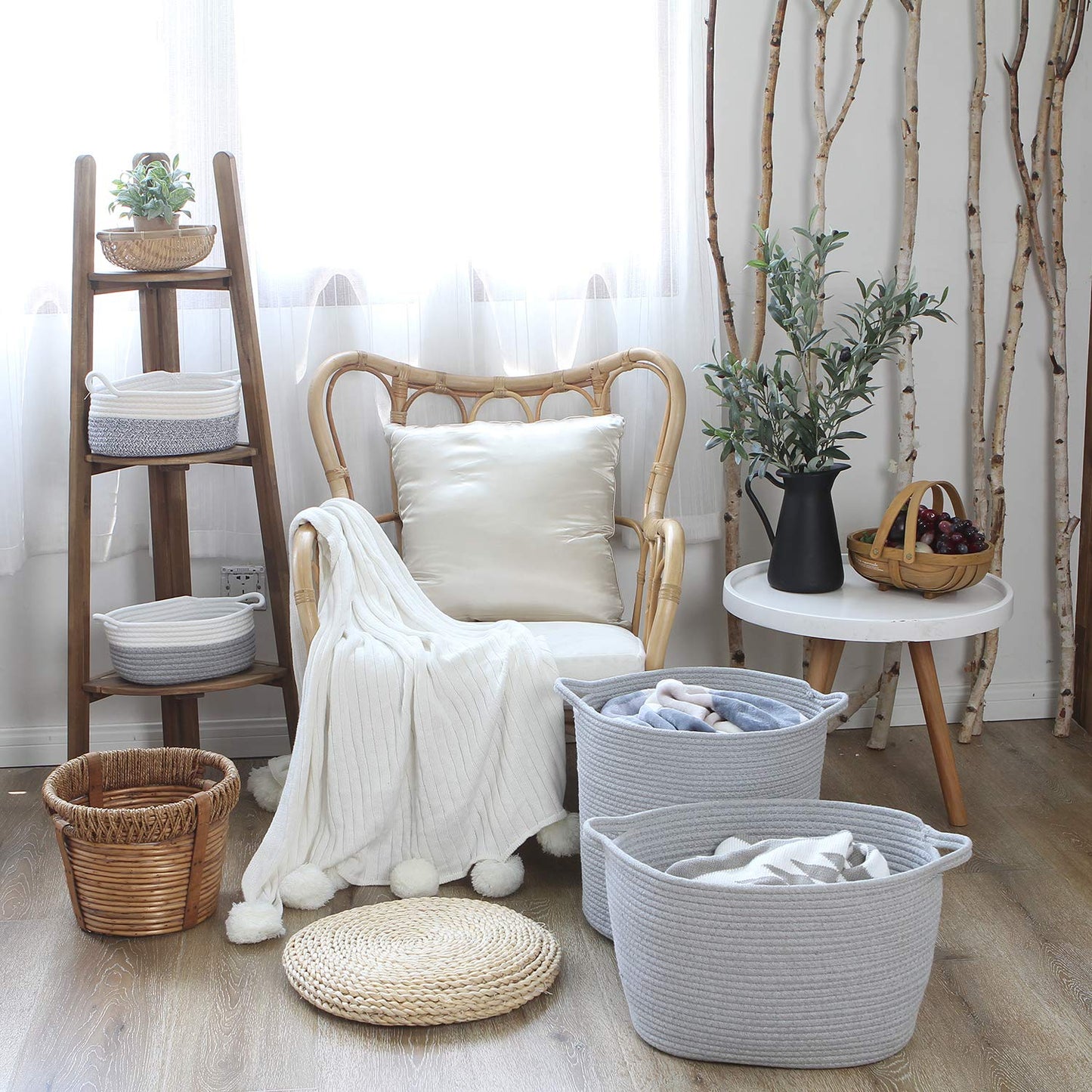 Oval grey cotton rope woven storage basket with handles, suitable for nursery diaper caddy or kid's room organization.