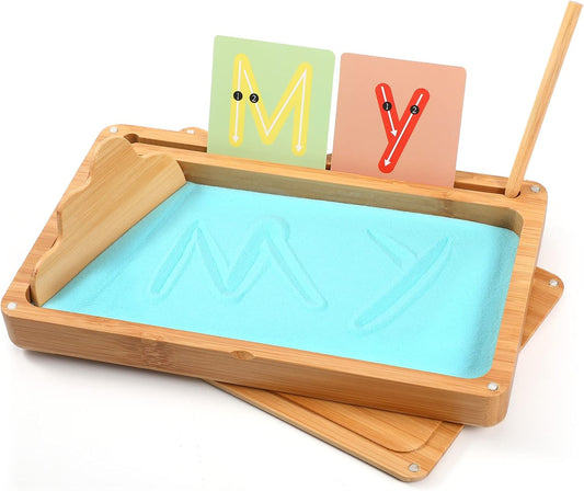 Blue wooden Montessori sand tray with lid for kids, ideal for writing letters and numbers in preschool and kindergarten classrooms.