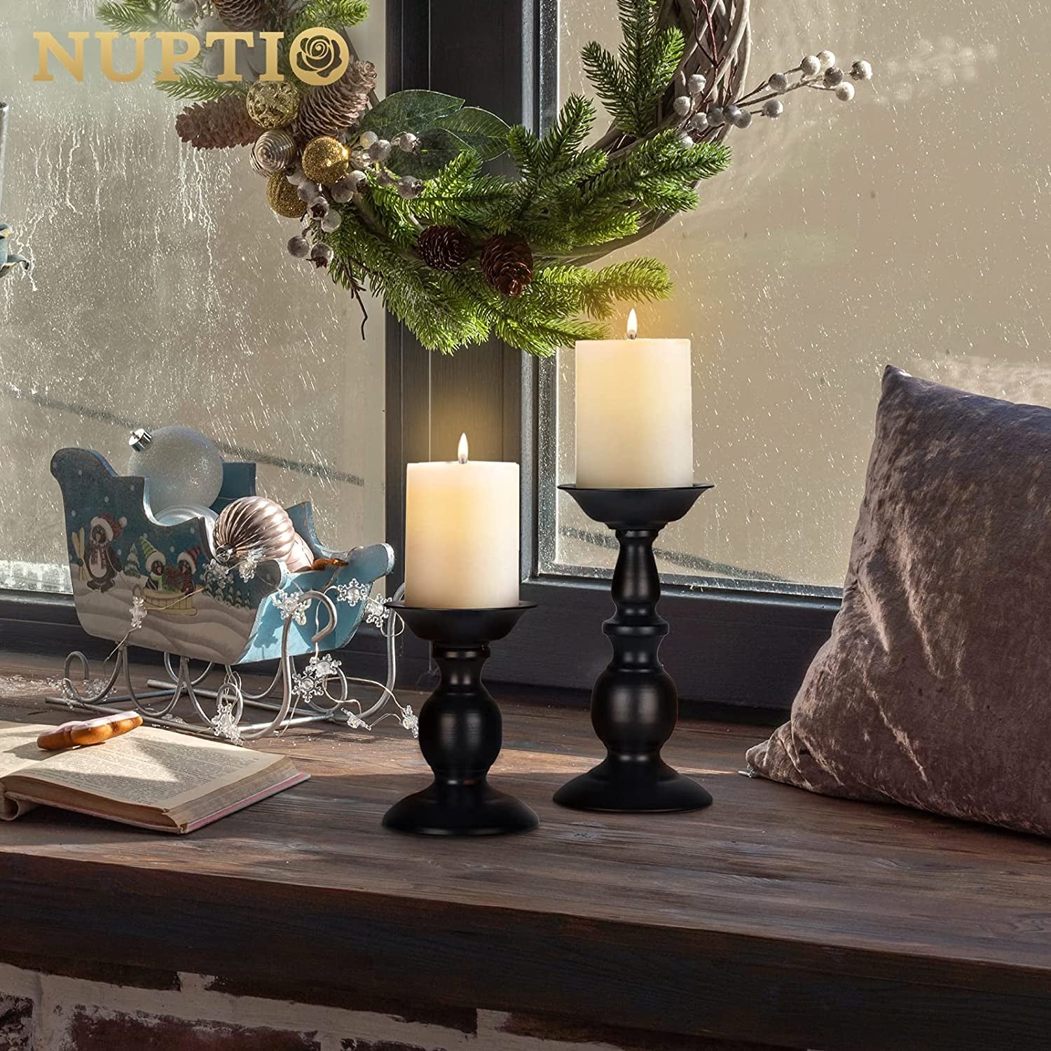 Set of two rustic black metal candle holders for pillar candles, vintage-style tall candle stands for home decor and seasonal table centerpieces.
