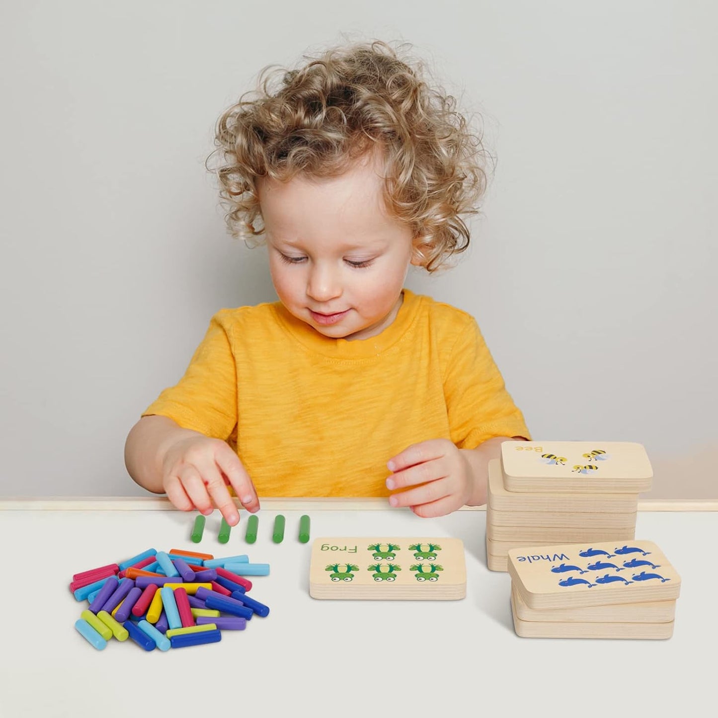 Wooden peg board with colorful pegs for toddler counting and math activities, suitable for Montessori learning and kindergarten fun.