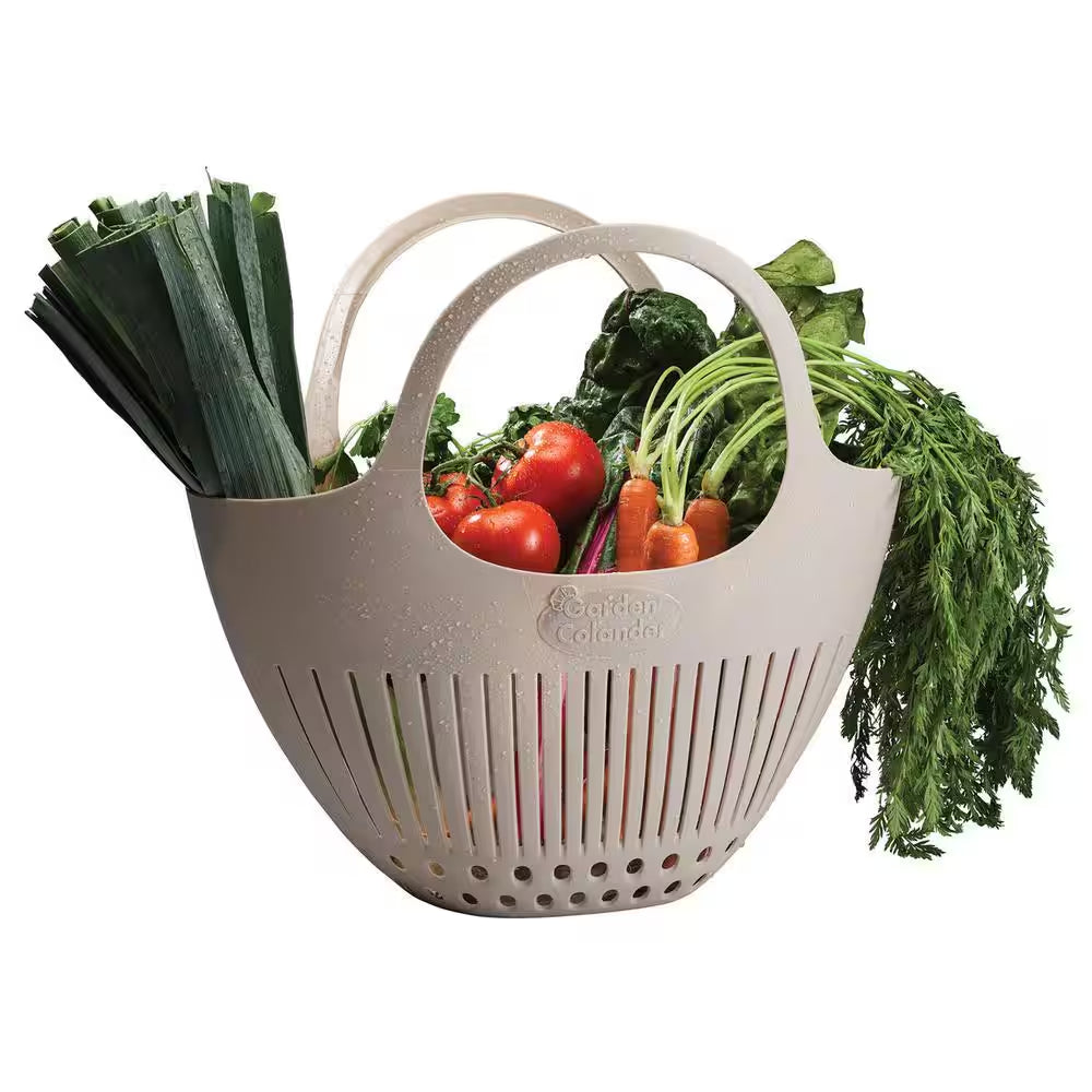 Pink garden colander harvest basket by X With Love with a sturdy handle and perforated design for easy fruit and vegetable collection.
