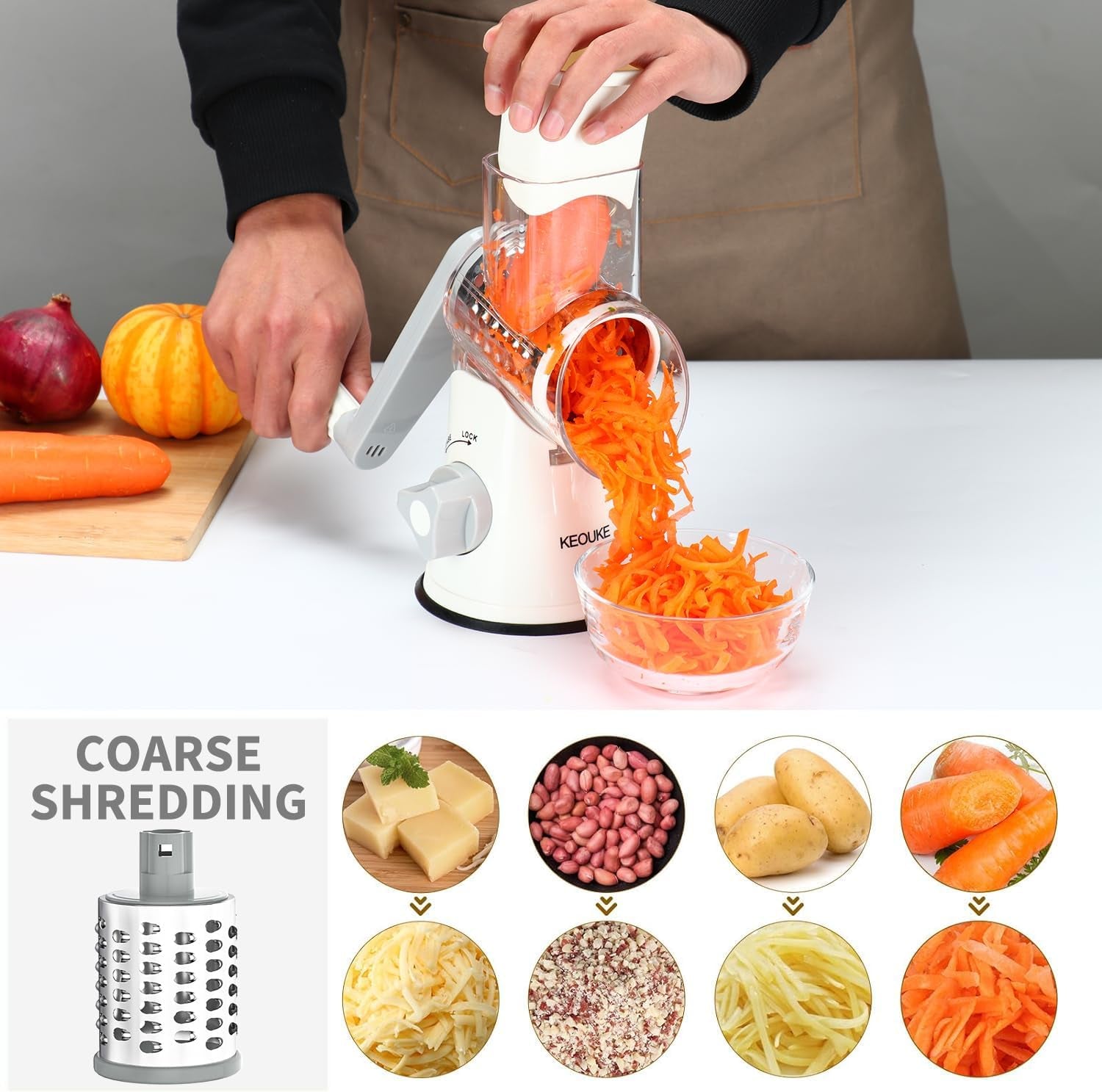 White rotary cheese grater with hand crank, three blades, non-slip suction base for shredding cheese, vegetables, and nuts.