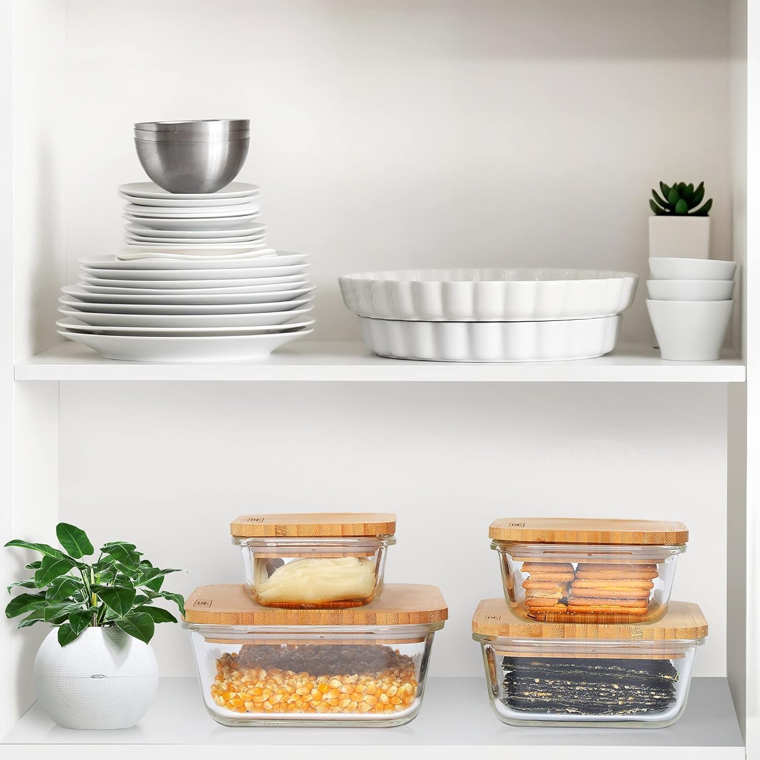 Set of four glass food storage containers with bamboo lids, varying sizes, oven and microwave safe, stackable and airtight.