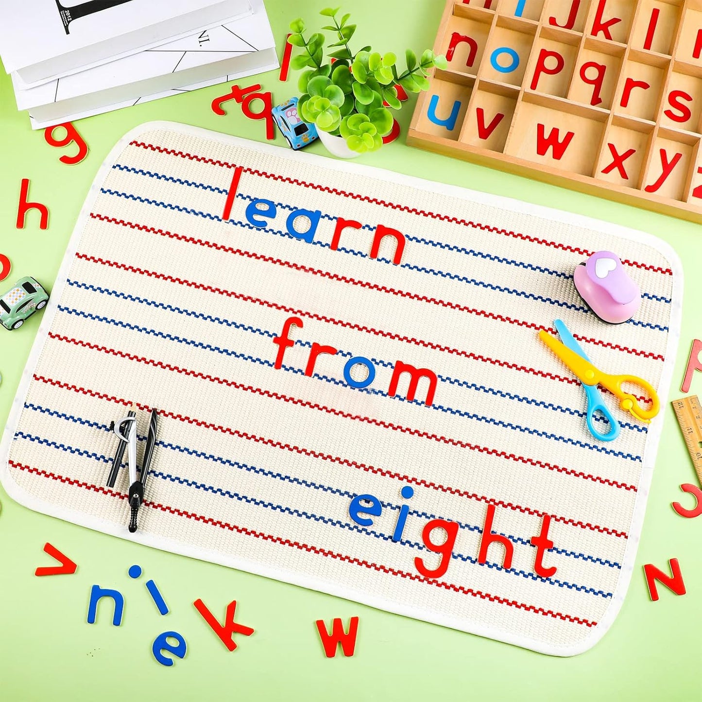 Wooden Montessori alphabet letters in red and blue with box and mats, designed for preschool spelling and language learning.