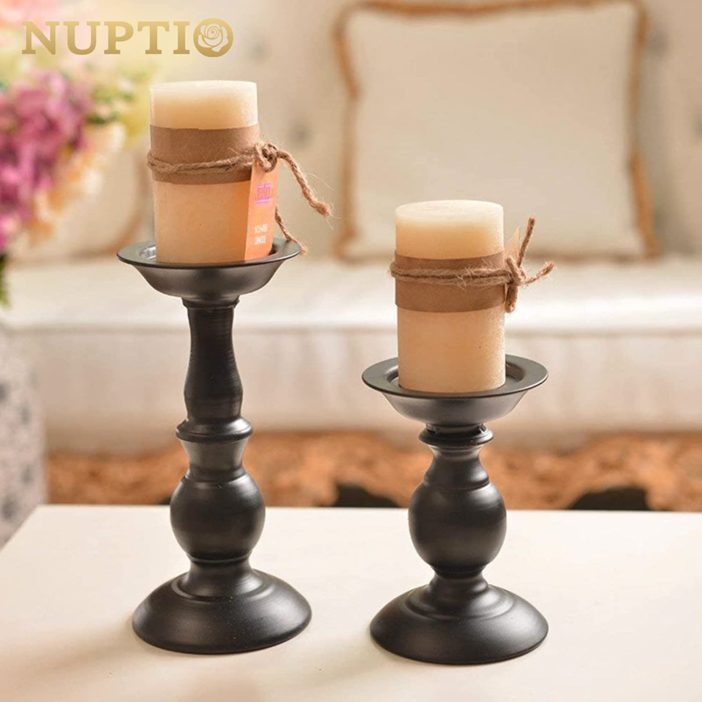 Set of two black metal pillar candle holders with rustic design, ideal for fall, Halloween, Easter, or farmhouse home decor.