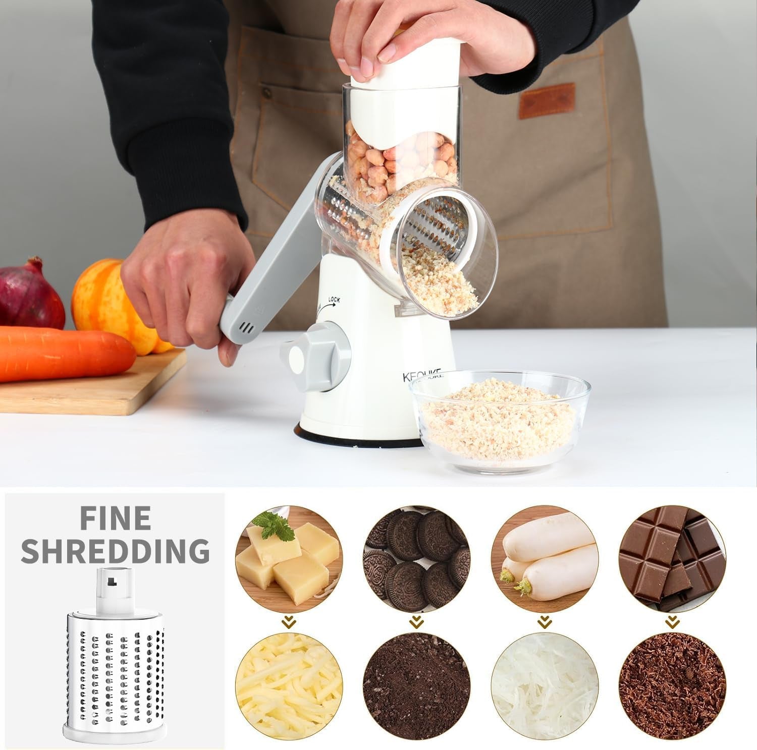 White rotary cheese grater with hand crank, three blades, non-slip suction base for shredding cheese, vegetables, and nuts.