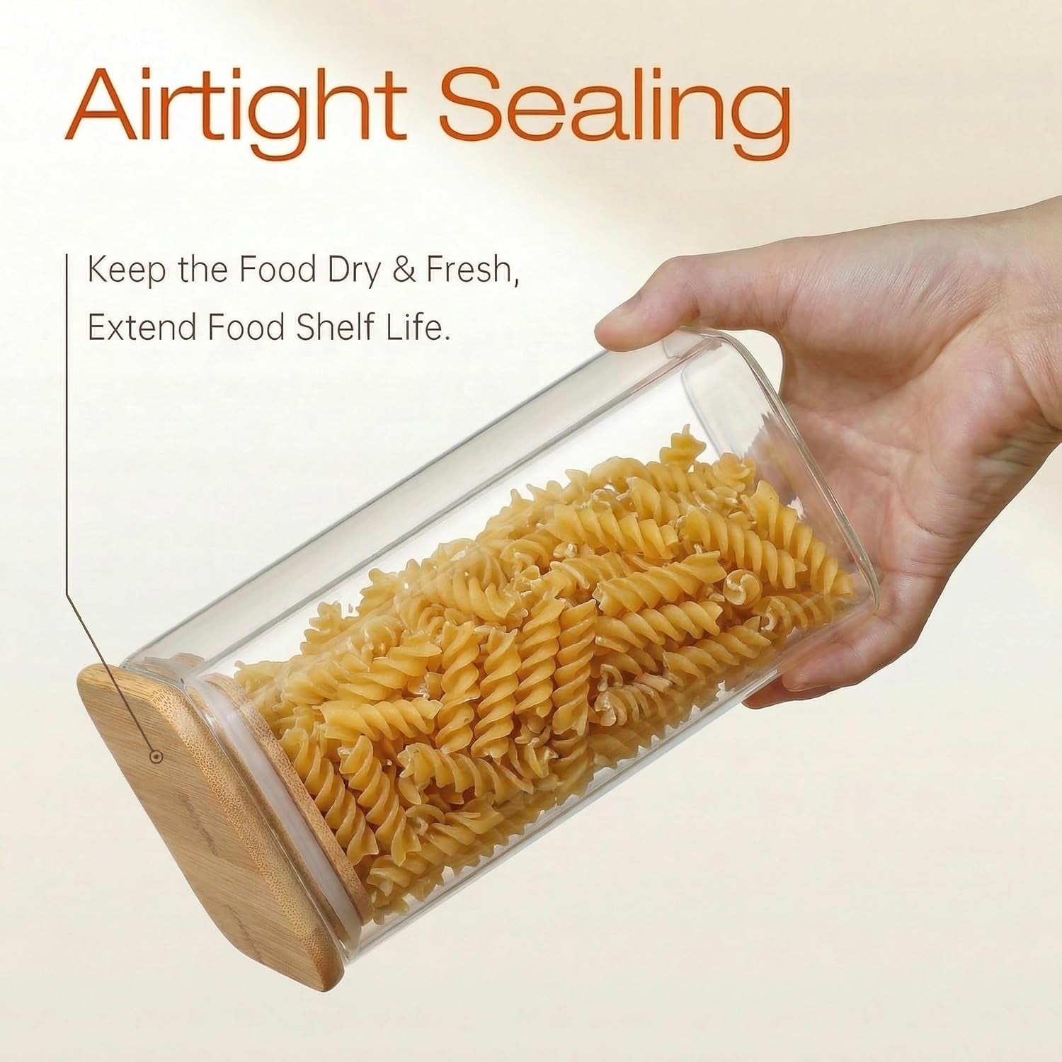 Set of five square glass jars with bamboo lids, food storage containers for pantry staples like pasta, cereal, flour, and sugar.