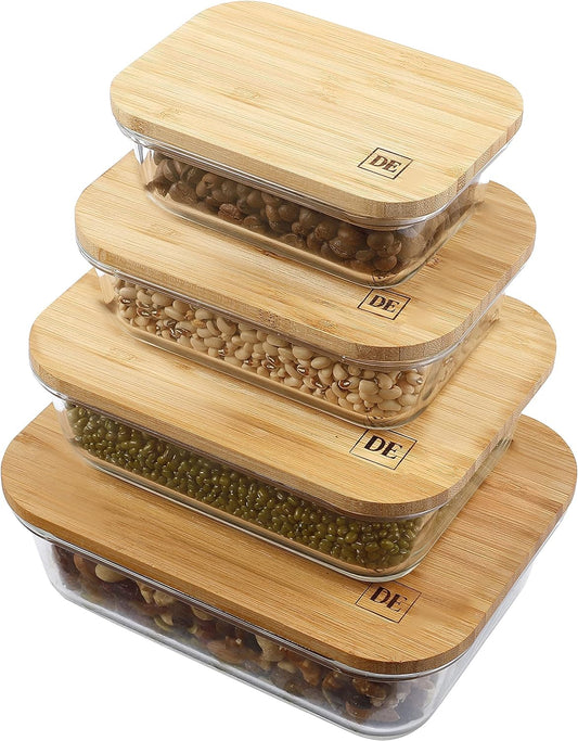 Set of four X With Love glass food storage containers with bamboo lids in various sizes, stackable, airtight, and microwave-safe.
