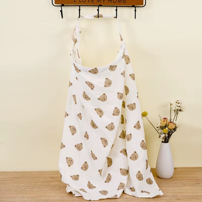 Breathable cotton baby nursing cover by X With Love, featuring soft muslin fabric, offering privacy for breastfeeding and baby feeding.