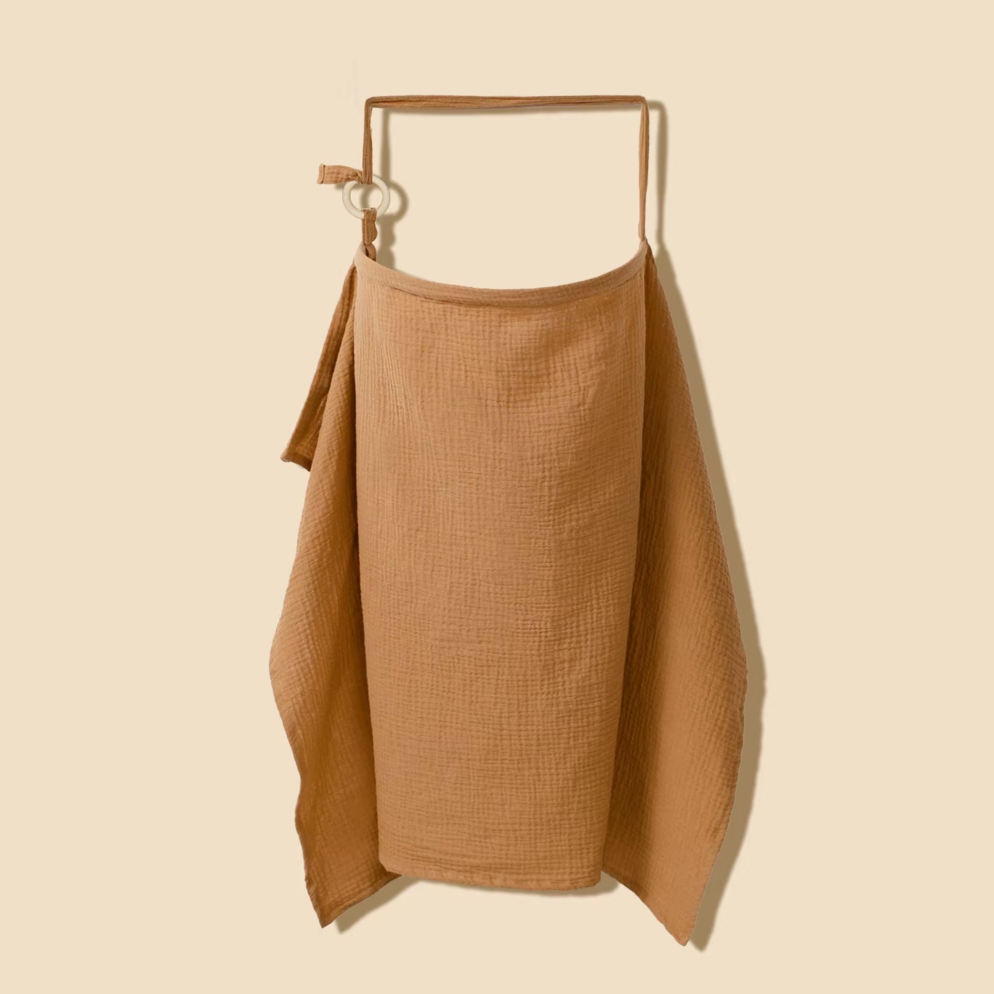 Breathable cotton muslin nursing cover by X With Love, a baby feeding blanket and privacy apron for breastfeeding and strollers.