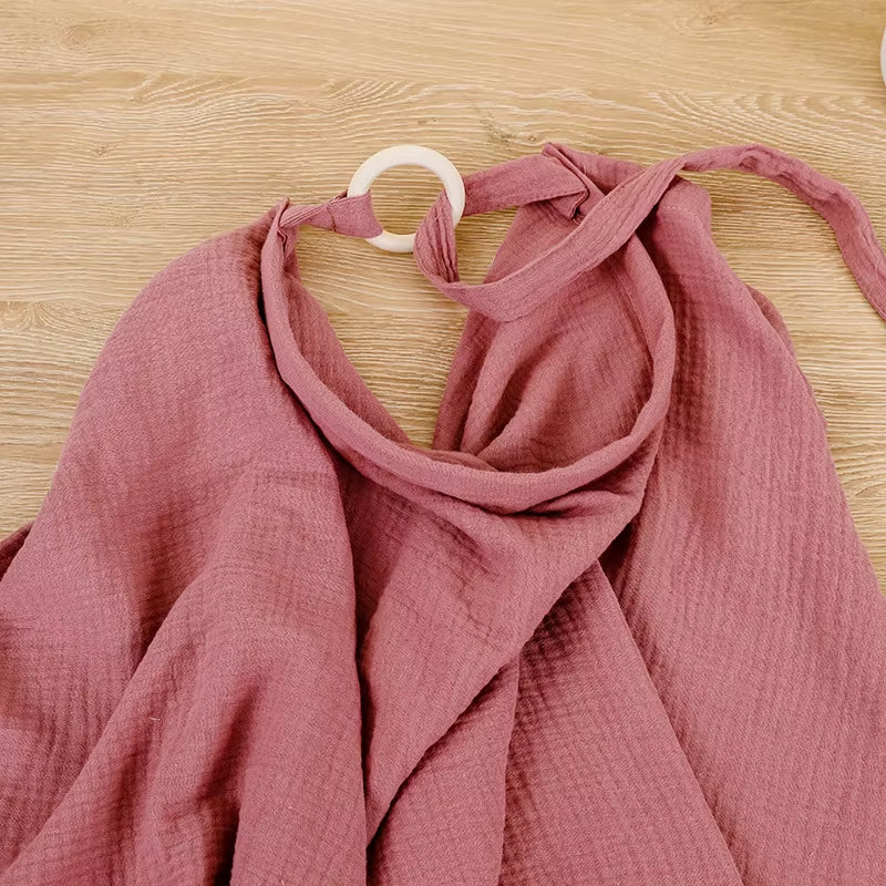 Breathable cotton muslin baby nursing cover by X With Love, providing privacy for breastfeeding and stroller use.