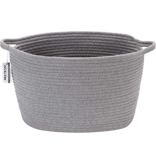 Oval grey cotton rope woven storage basket with handles, ideal for nursery diaper caddy or kid's room organization, medium size.