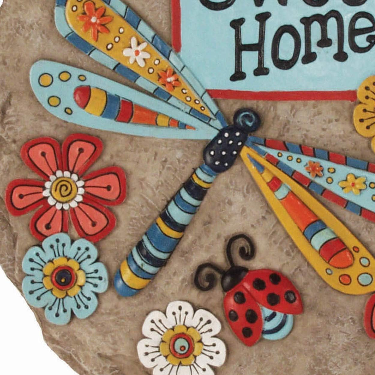Decorative garden stepping stone featuring a dragonfly design, labeled "Home Sweet" by X With Love garden décor collection.