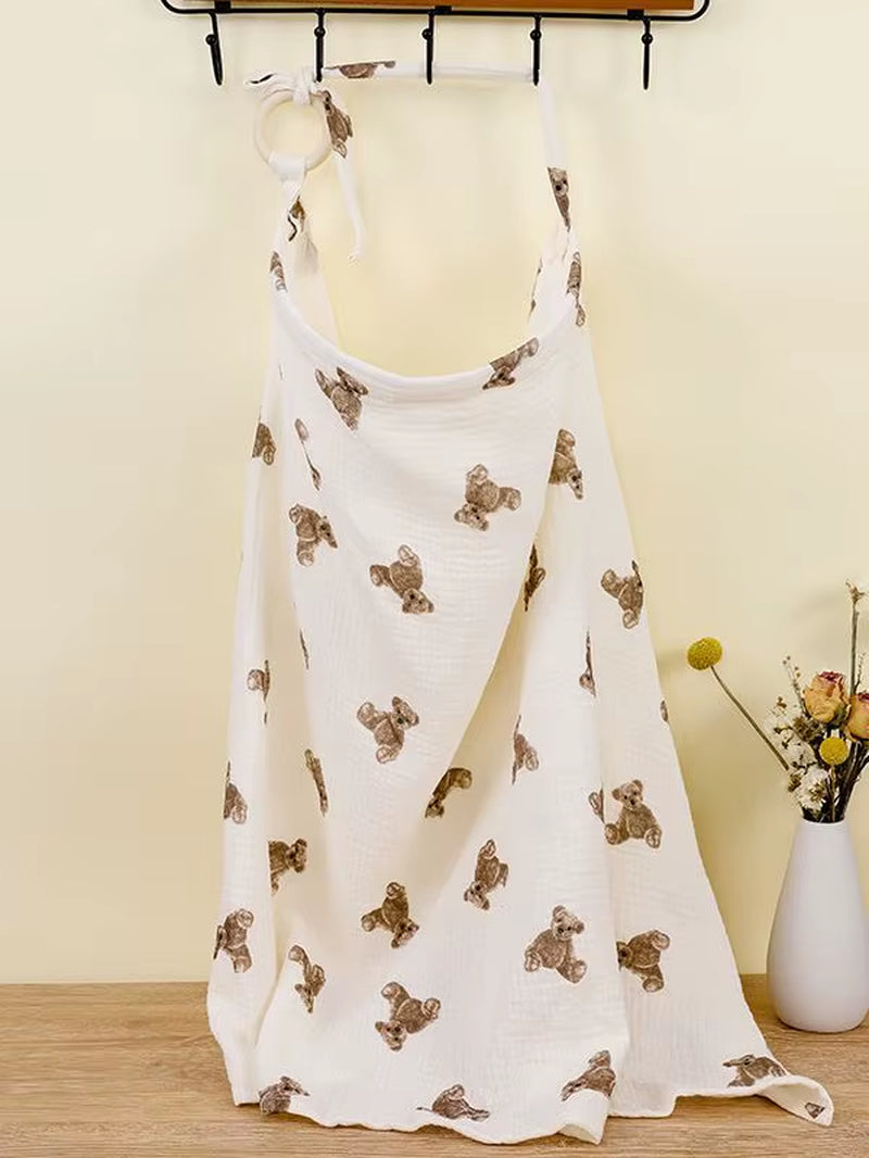 Breathable cotton muslin baby nursing cover by X With Love, providing privacy for breastfeeding and stroller use.