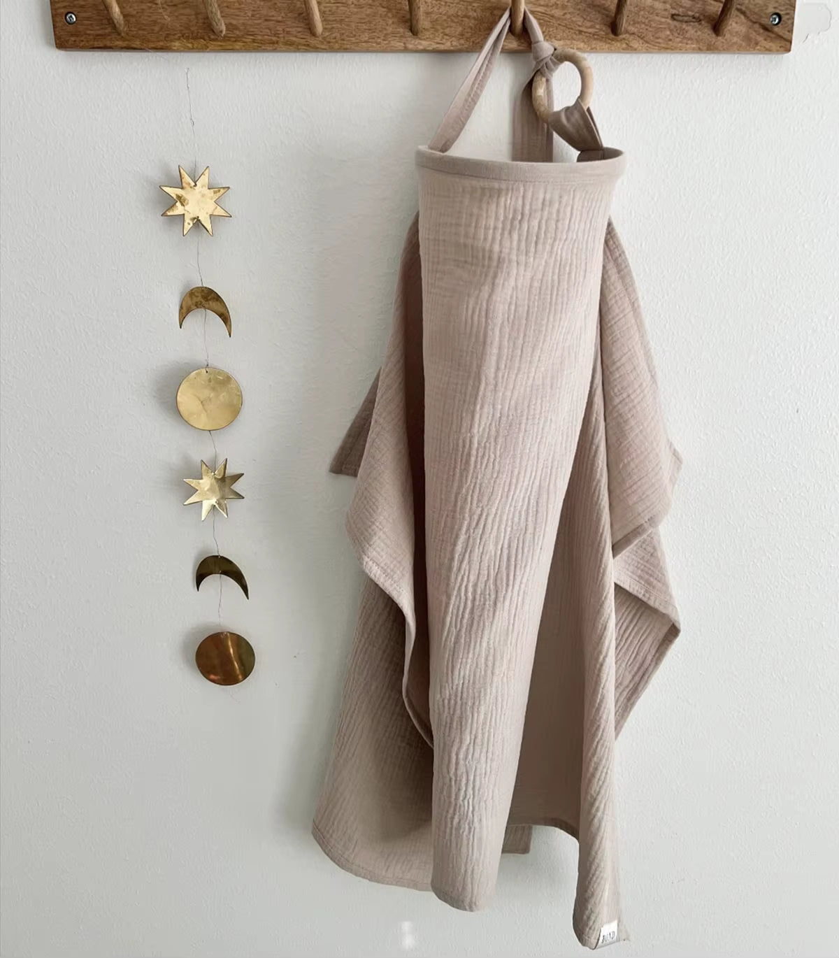 Breathable cotton muslin baby nursing cover by X With Love, showing a lightweight maternity breastfeeding apron and stroller blanket.